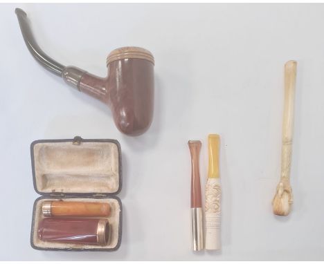 Two 9ct gold mounted cheroot holders, other cheroot holders, a pipe and other items&nbsp;