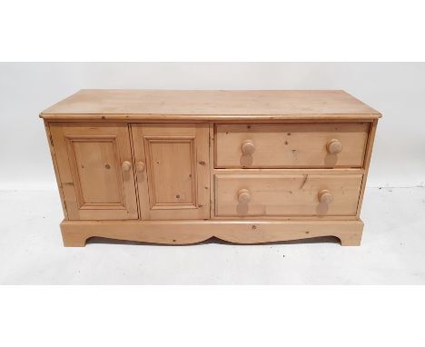 20th century low pine unit, the rectangular top with moulded edge, rounded front corners, to the left a pair of cupboard door