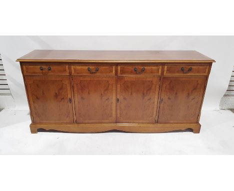 Modern yew sideboard with four drawers, four cupboard doors, on bracket feet, 181cm x 81cm