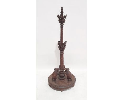 Anglo Indian style 20th century standard lamp in Eastern hardwood, the column carved with various figures and elephants, on l