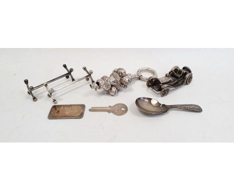 Victorian silver rattle, Birmingham 1893, with floral scrolling decoration with integral whistle and hung with bells, 13cm lo