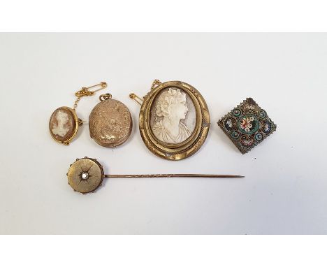 Gold coloured stick pin, the circular finial set with a central diamond, a small shell cameo brooch with gold coloured mount,