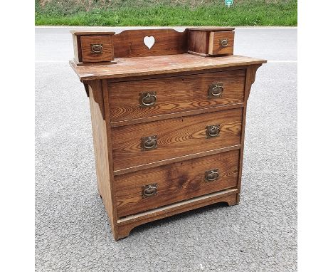 20th century chest of drawers with two drawers to the superstructure, with pierced heart to the back, above the three drawers