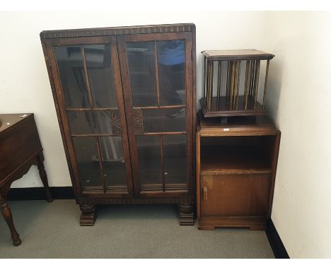 Early 20th century oak bookcase, a bedside cabinet and a table-top revolving bookcase (3) 