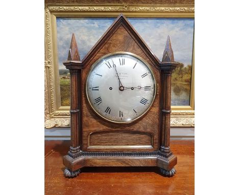 19th century rosewood bracket clock having pointed arched top and pointed square section finials, with brass inlay, steel dia