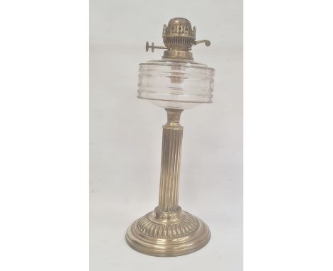 Old brass oil lamp with cut glass drum shaped well on reeded column and gadrooned circular base, 47cm high