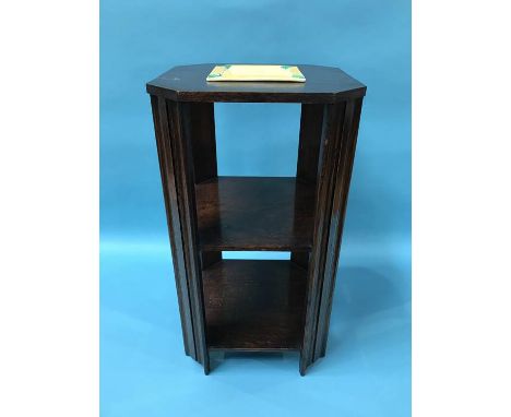 A Clarice Cliff 'Bizarre' ash tray, on an oak stand