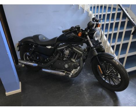 A Harley Davidson 883cc 'Sportster', first registered November 2012, mileage stated 3,957, two keys, History; the bike has be