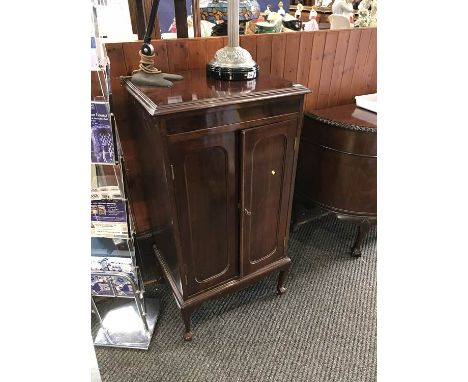 A mahogany music cabinet