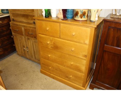 A light oak chest fitted two short over three long drawers 