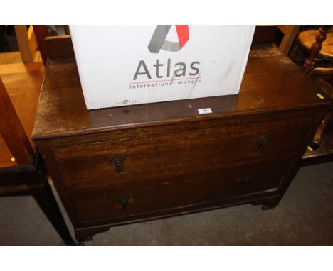 An oak two door chest; a folding card table; a wall mirror; a square top table and a standard lamp