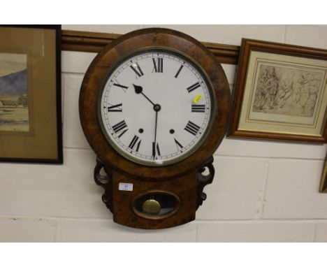 A Victorian walnut two hole drop dial wall clock