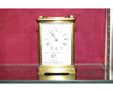 A brass cased carriage clock