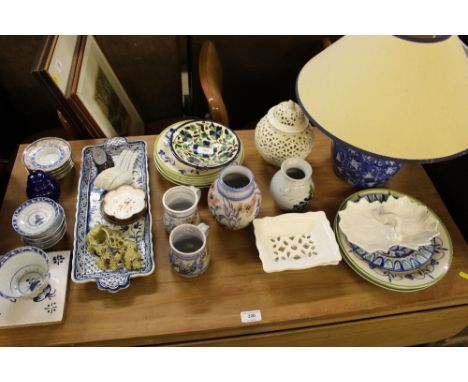A quantity of various pottery; small Chinese dishes; a blue and white table lamp and shade