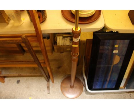 An Art Deco style teak standard lamp and shade