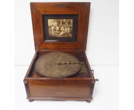 Victorian walnut cased table top Polyphon musical disc player, the hinged cover with a central foliate marquetry panel, openi