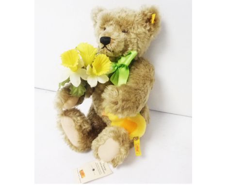 Steiff Growler Teddy Bear No 654466 'Spring', holding daffodils and chick. Button in ear and also on chick. Tag still attache