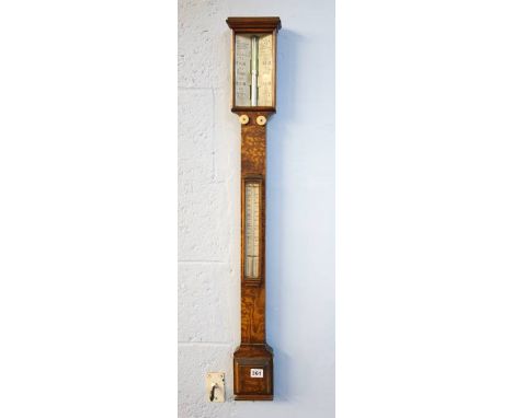 An oak cased stick barometer.