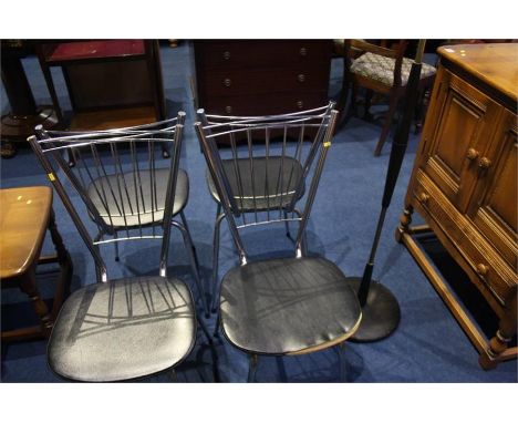 Four 1970's chrome chairs and a standard lamp.