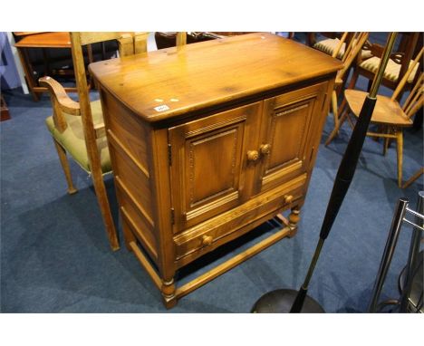 Ercol oak cabinet.