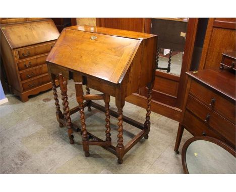 A late 17th century Walnut jointed standing gate leg desk, with fall front, gate action on barley twist supports. (See 'Oak f