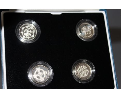 A ROYAL MINT SILVER PROOF £1 FOUR COIN SET, dated 1999, 2000, 2001 and 2002, with COA/Booklet, in original presentation case