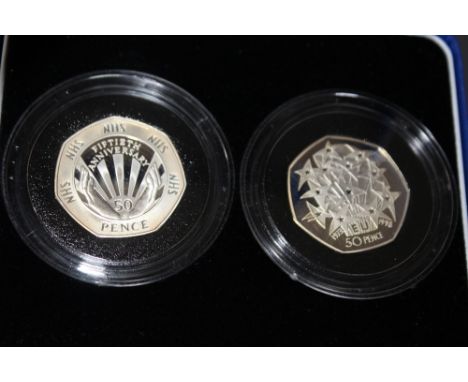 A ROYAL MINT 1998 PIEDFORT SILVER PROOF 'EEC' 50 PENCE AND 'NHS' 50 PENCE TWO COIN SET, with COA/Booklet, in original present