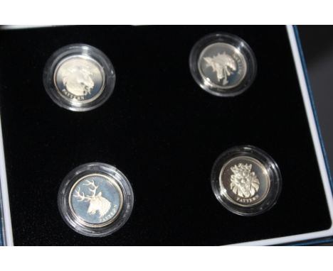 A ROYAL MINT 2004 UNITED KINGDOM SILVER PATTERN FOUR £1 COIN SET, comprising Scotland, Northern Ireland, Wales and England, w