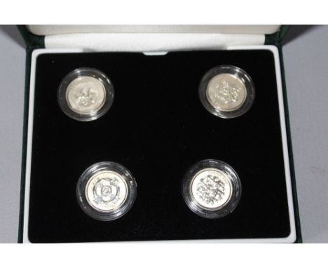 A ROYAL MINT 1999 - 2002 UNITED KINGDOM SILVER PROOF £1 FOUR COIN SET, comprising 2001 and 2002 coins with special frosted fi