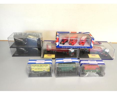 Oxford Diecast. A group of 1:76 scale boxed models behind plexiglass cases to include "Haulage Company" Pollock Scotrans SCA0