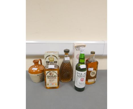 Four bottles of Blended Scotch Whisky, Old decanter containing Whyte &amp; MacKays Supreme, 70 proof, Old bottle of Long John