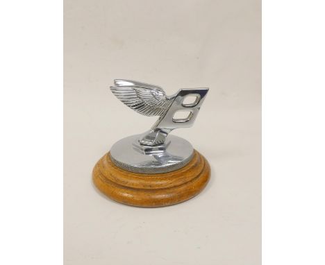 Vintage c1930s Bentley chrome car mascot on wooden stand. Height 10.5cm&nbsp; 