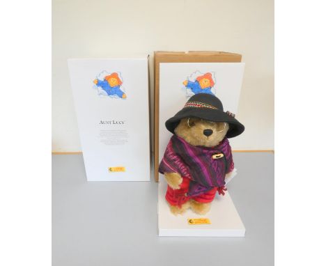 Steiff. Paddington Aunt Lucy Teddy Bear, 2006, white tag 662409, in blonde mohair with shawl and gold frame glasses. Complete