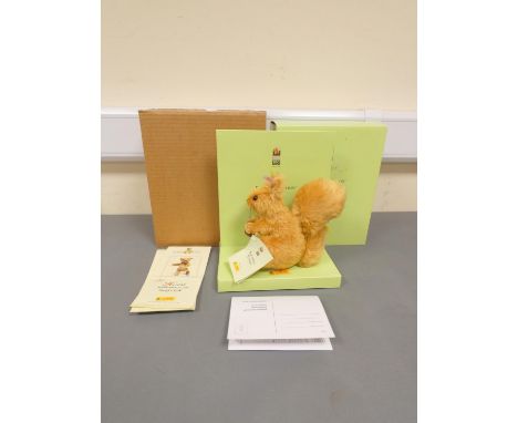 Steiff. Squirrel Nutkin, 2004, white tag 354304, in reddish brown mohair. Complete with swing certificate and box, 5.9"/15cm.