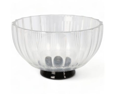 VICKE LINDSTRAND for Orrefors, Sweden, a 1930s' clear glass ribbed bowl on black foot, marked to base Of LA 355, diameter 20.