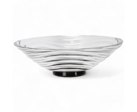 SIMON GATE for Orrefors, a large 1930s' wave pattern clear glass bowl on black foot, marked to base, Orrefors GA 400/8, diame