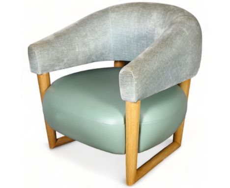 Manner of Jean Royere, a green leather and velvet unholstered, oak frame lounge chair on sled base, height 80cm (option to bu