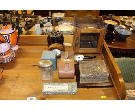 An oak smokers cabinet; a faux tortoiseshell mantel clock; a pair of brushes; tobacco jar etc. 