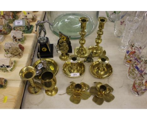 A quantity of brass candlesticks, chamber stick, trophies etc. 