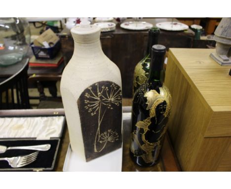 A Studio pottery table lamp base; together with a pair of gilt decorated wine bottles - one with contents 