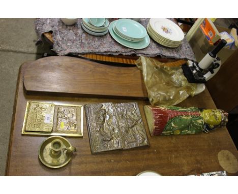 A carved wooden and painted figure; two brass letter racks; a brass chamber stick; a microscope etc. 