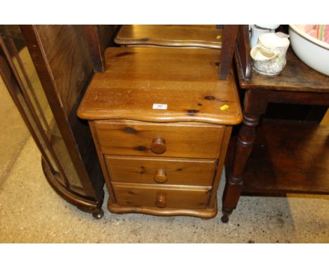 A pair of pine three drawer bedside chests; and a Victorian oak commode