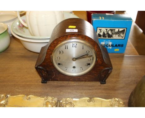 A 1930's soak cased three hole mantel clock