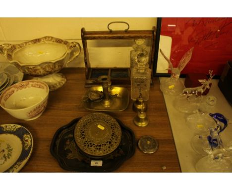 An oak three bottled Tantalus; a 19th Century brass chamber stick and Eastern white metal compact; a chinoiserie tray etc.