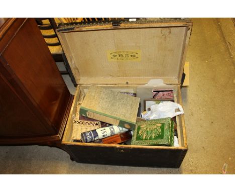 A large trunk of various sundries; a small leather suitcase; a tape measure; a clock etc.