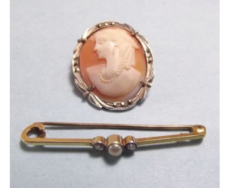 A 9 carat gold Edwardian bar brooch set pearl and two diamonds and a silver cameo brooch 