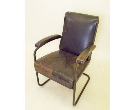 A vintage 'leather' upholstered metal frame office chair 