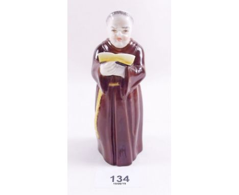 A Royal Worcester candlesnuffer in the form of a monk 