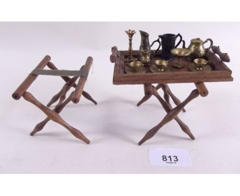 A Victorian gilt metal dolls house miniature six piece teaset and similar style candlestick, wooden tray, tray stands etc