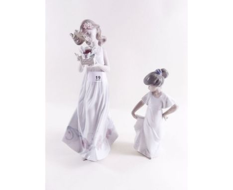 A Lladro figure - girl with butterflies and a Nao figure